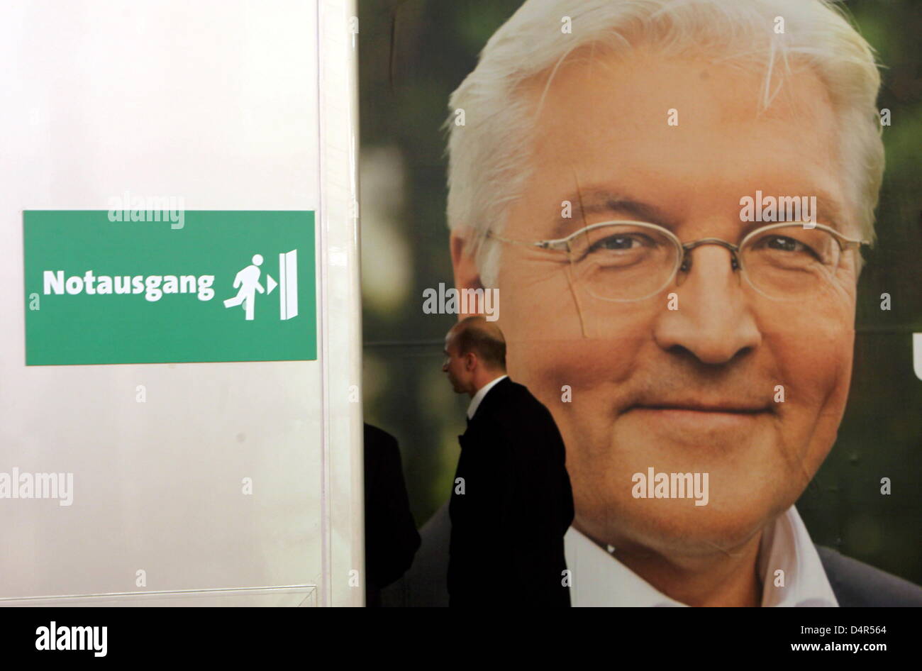 An emergency exit sign next to an election poster of SPD, Social ...