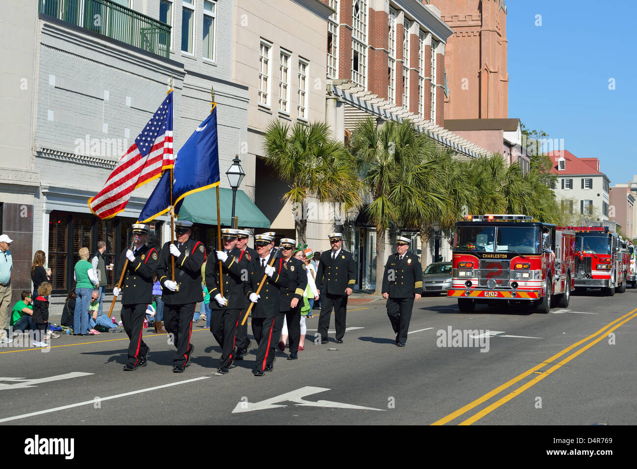 Fire Department color guard parading in St. Patrick's Day parade Stock Photo