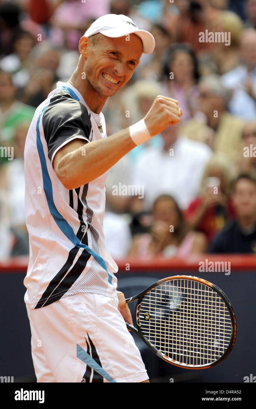 Russian Nikolay Davydenko cheers winning over France?s Paul-Henri Mathieu the finals match at the ATP German Open ?Am Rothenbaum? stadium in Hamburg, Germany, 26 July 2009. Photo: MAURIZIO GAMBARINI Stock Photo