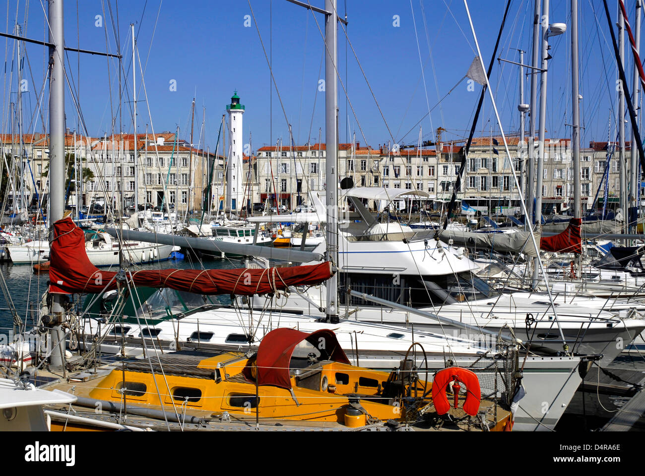 Port of La Rochelle in France with the buildings and lighthouse in the background. Region Poitou Charentes, Charente Maritime Stock Photo