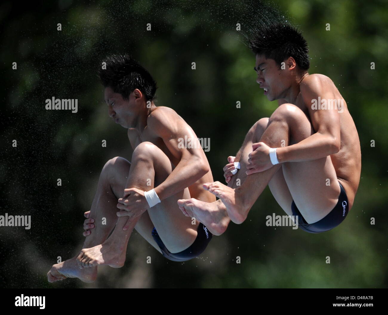 China?s Huo Liang and Lin Yue dive off the 10m springboard during the ...