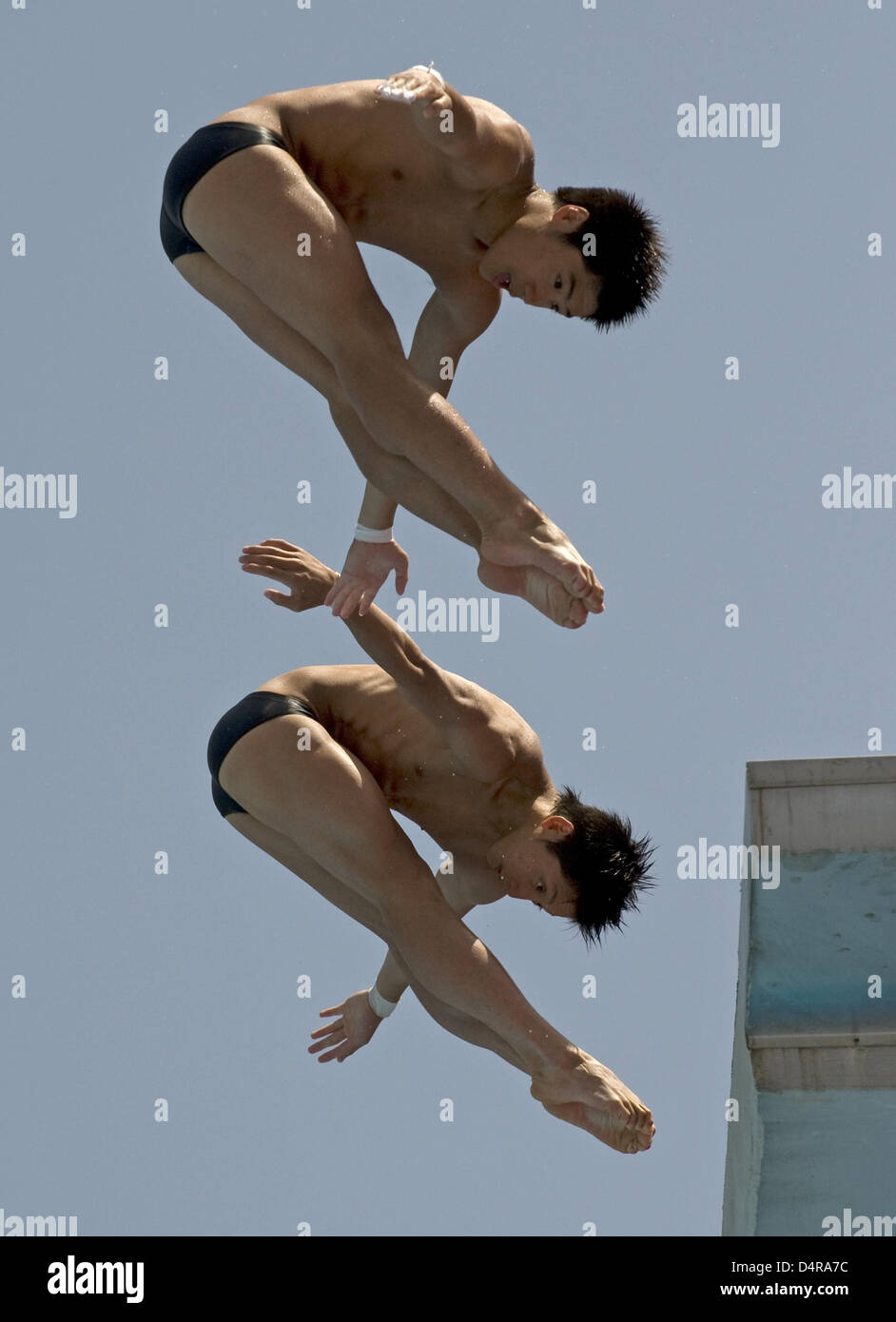China?s Huo Liang and Lin Yue dive off the 10m springboard during the ...