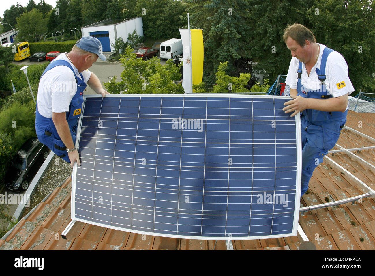 fitters-install-panels-of-a-photovoltaic-plant-on-the-roof-of-pope