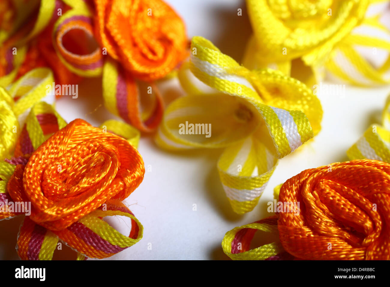 Yellow and orange ribbon flower embellishments Stock Photo Alamy