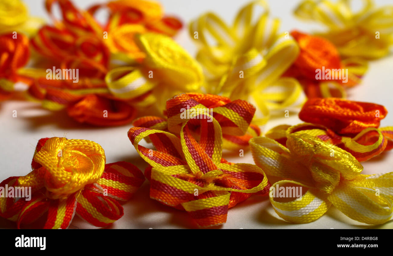 Yellow and orange ribbon flower embellishments Stock Photo Alamy