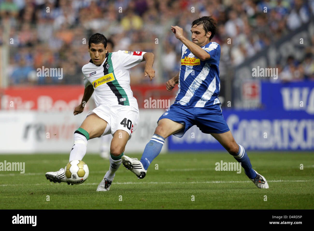 Bochum?s Daniel Imhof (R) and Moenchengladbach?s Karim Matmour vie for the ball during the German Bundesliga match VfL Bochum vs Borussia Moenchengladbach at rewirpower-stadium in Bochum, Germany, 09 August 2009. Photo: Rolf Vennenbernd dpa/lnw (ATTENTION: BLOCKING PERIOD! The DFL permits the further utilisation of the pictures in IPTV, mobile services and other new technologies on Stock Photo