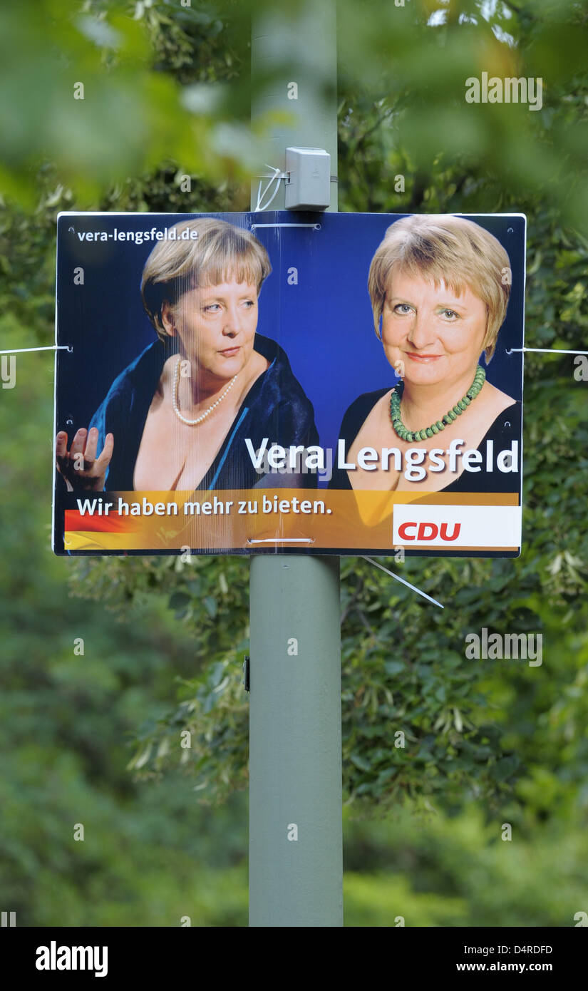 An election poster reading ?We have more to offer? displays Vera Lengsfeld (R), direct canddidate for Berlin?s Christian Democrats (CDU), and German Chancellor Angela Merkel (L), CDU top candidate for the federal elections, in Berlin, Germany, 11 August 2009. The photo of Mrs Merkel sporting a revealing cleavage during the opening of Oslo?s new opera in 2008 had evoked a broad reac Stock Photo