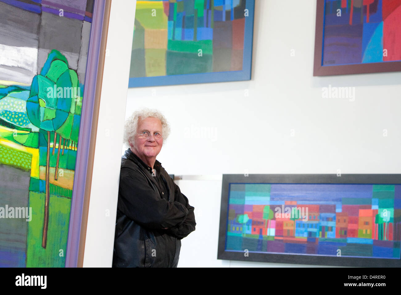 Dutch painter Ton Schulten smiles between his works in the Centre for  Environmental Communication of German Foundation Environment (DBU) in  Osnabrueck, Germany, 14 October 2009. Schulten?s works are on display in the