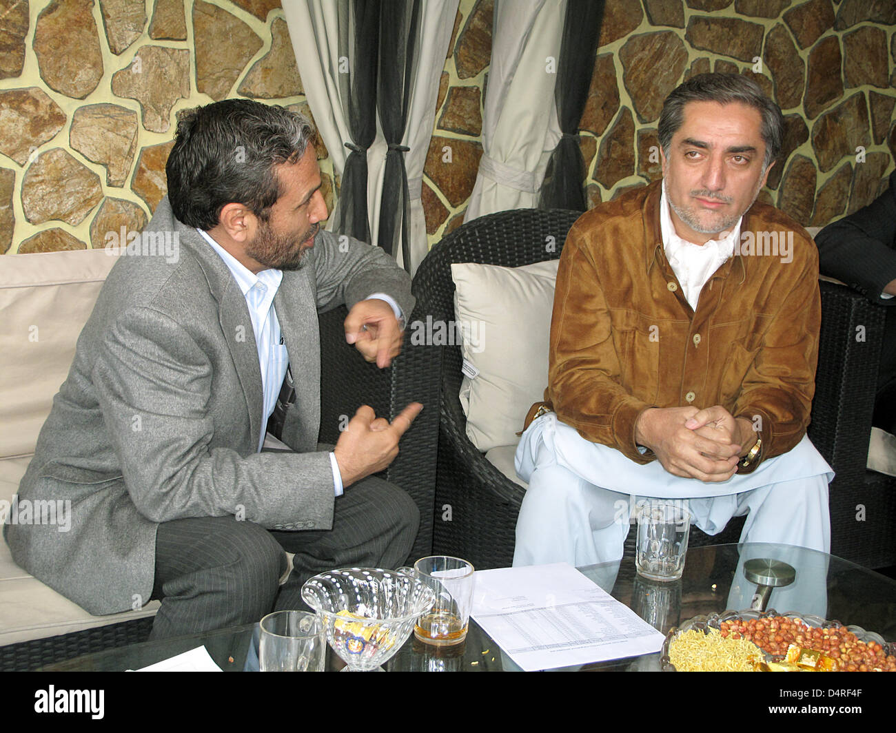 Abdullah Abdullah (R), challenger to Afghan President Karzai, talks to ...