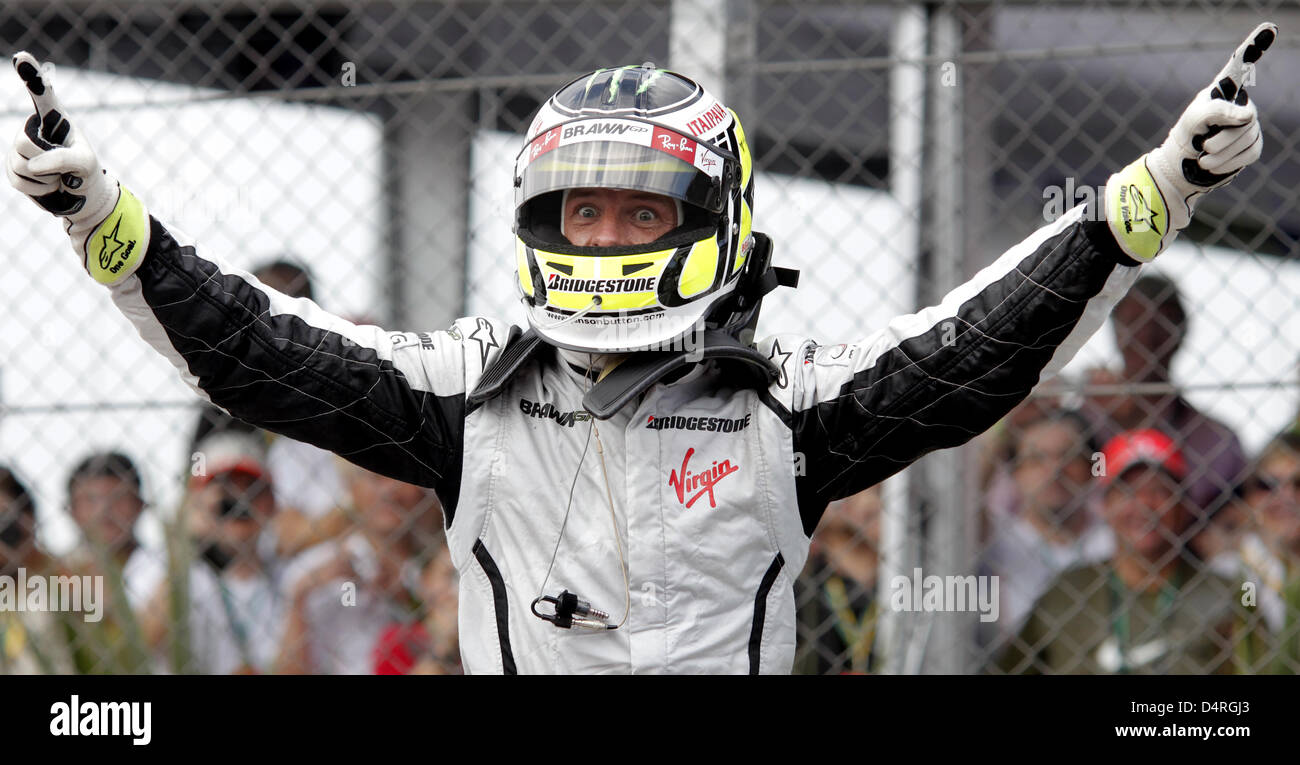 New World Champion British Formula One driver Jenson Button of Brawn GP  cheers after the Formula 1 Grand Prix of Brazil at Jose Carlos Pace race  track in Interlagos near Sao Paulo,