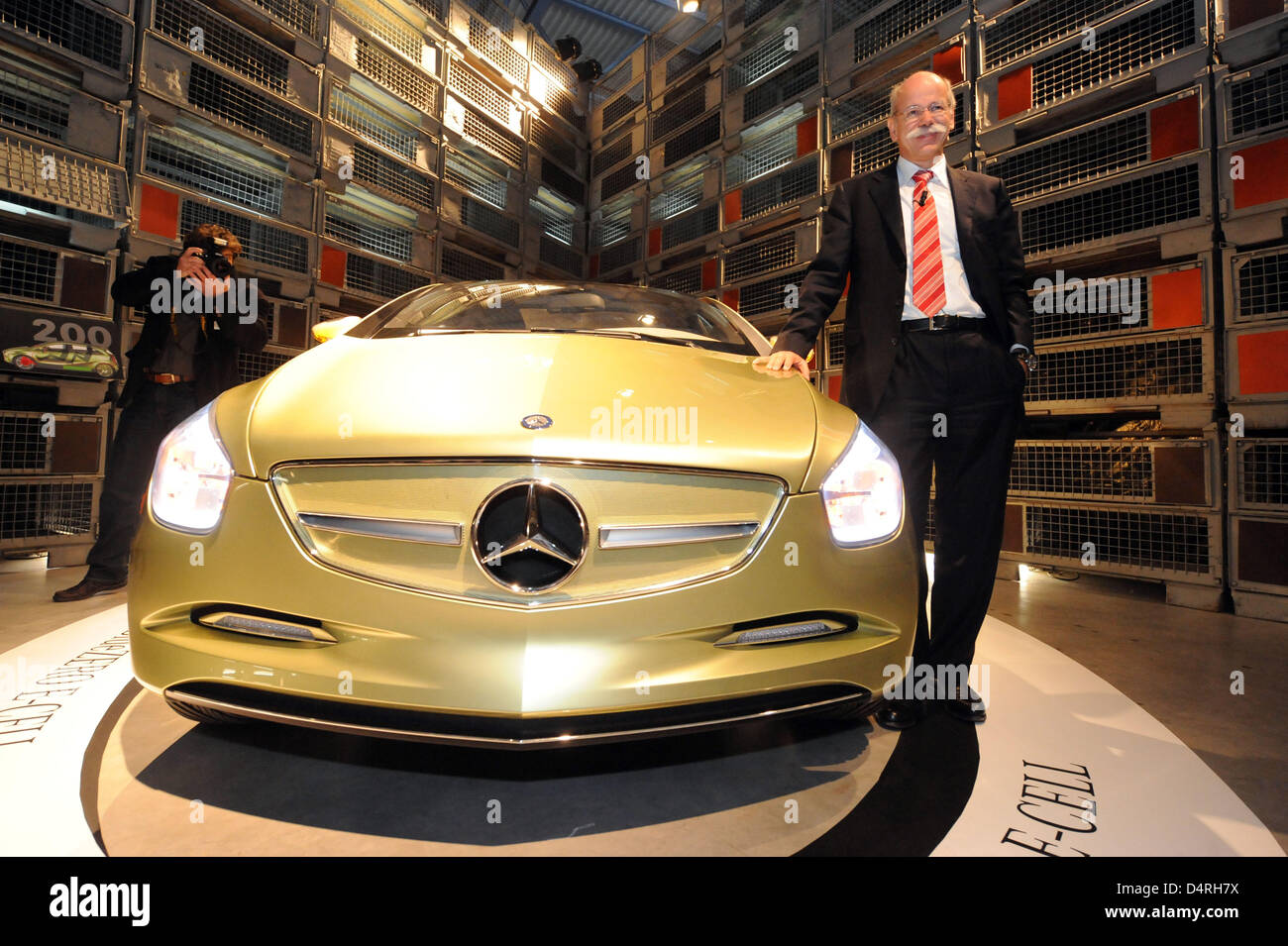 Daimler CEO Dieter Zetsche poses with a Mercedes BlueZero E-Cell in the building shell of new Mercedes production hall in Rastatt, Germany, 22 October 2009. The same day it was released that Mercedes? A and B class will be produced at the very location. Photo: ULI DECK Stock Photo
