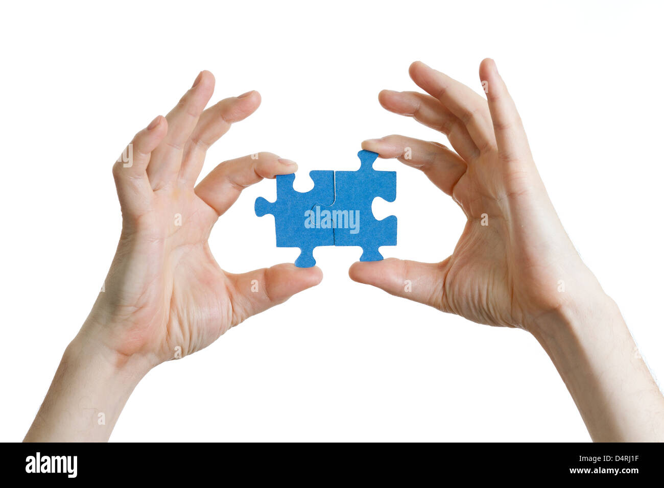 puzzle in hand isolated on white Stock Photo - Alamy