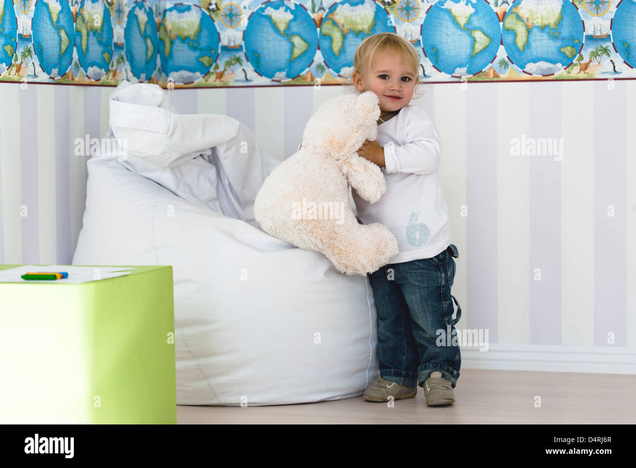 Baby boy holding teddy bear Stock Photo - Alamy