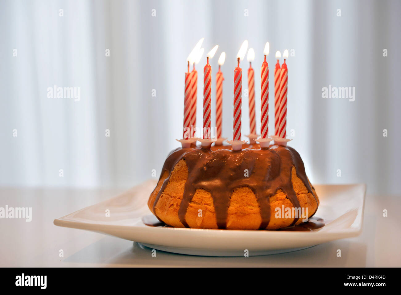 A birthday cake with candles Stock Photo - Alamy