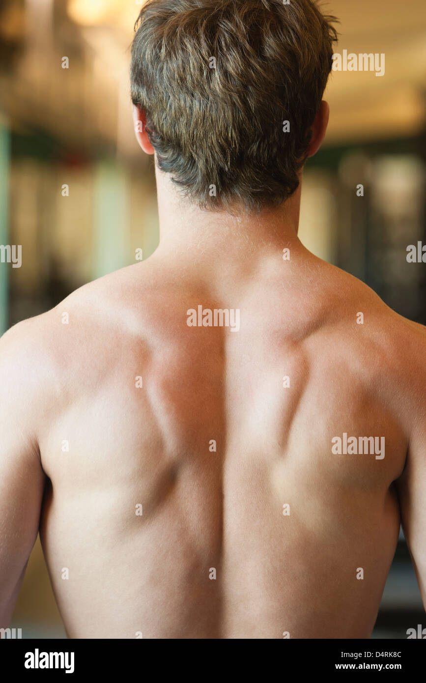 Barechested man, rear view Stock Photo
