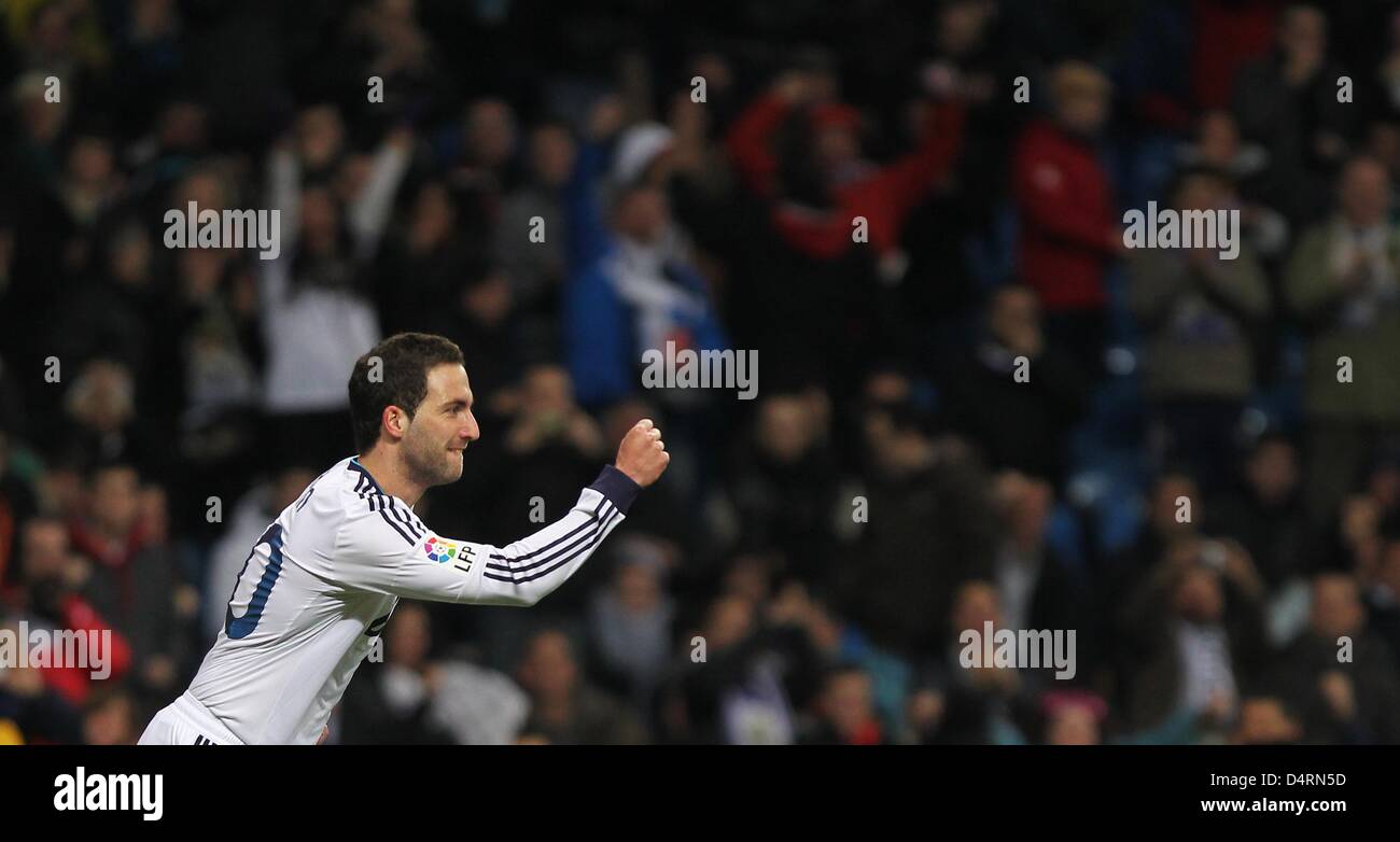 Real Madrid's Gonzalo Higuain celebrates after scoring the 1:1-equalizer during the Spanish Primera Division soccer match between Real Madrid and RCD Mallorca at Santiago Bernabeu stadium in Madrid, Spain, 16 March 2013. Madrid won 5:2. Photo: Fabian Stratenschulte/dpa Stock Photo