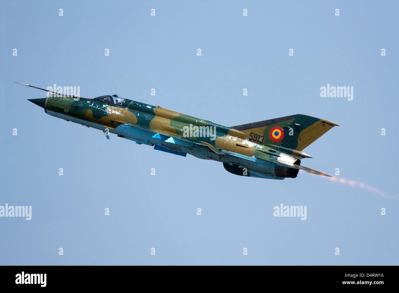 Romanian Air Force MiG-21 MF LanceR-A with afterburner during Otopeni Air Show 2010 in Bucharest, Romania. Stock Photo
