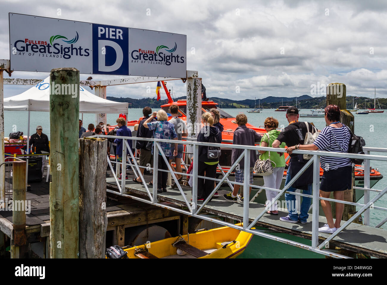 Passengers embarking on cruise ship tender at Paihia, Bay of Islands, Northland, Ned Zealand. Stock Photo