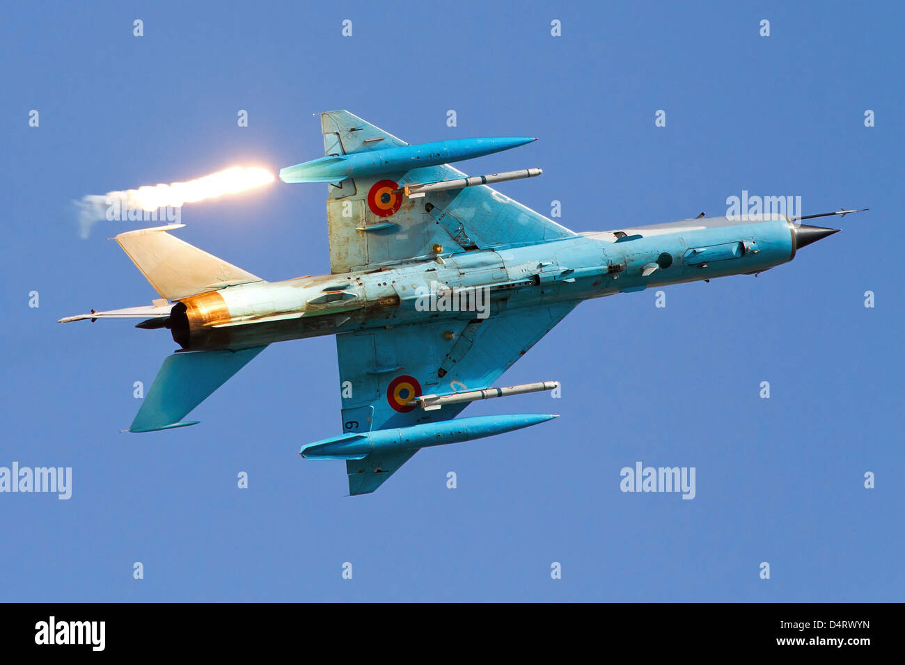 Romanian Air Force MiG-21 MF LanceR-C popping flares during Bucharest International Air Show 2012 Stock Photo