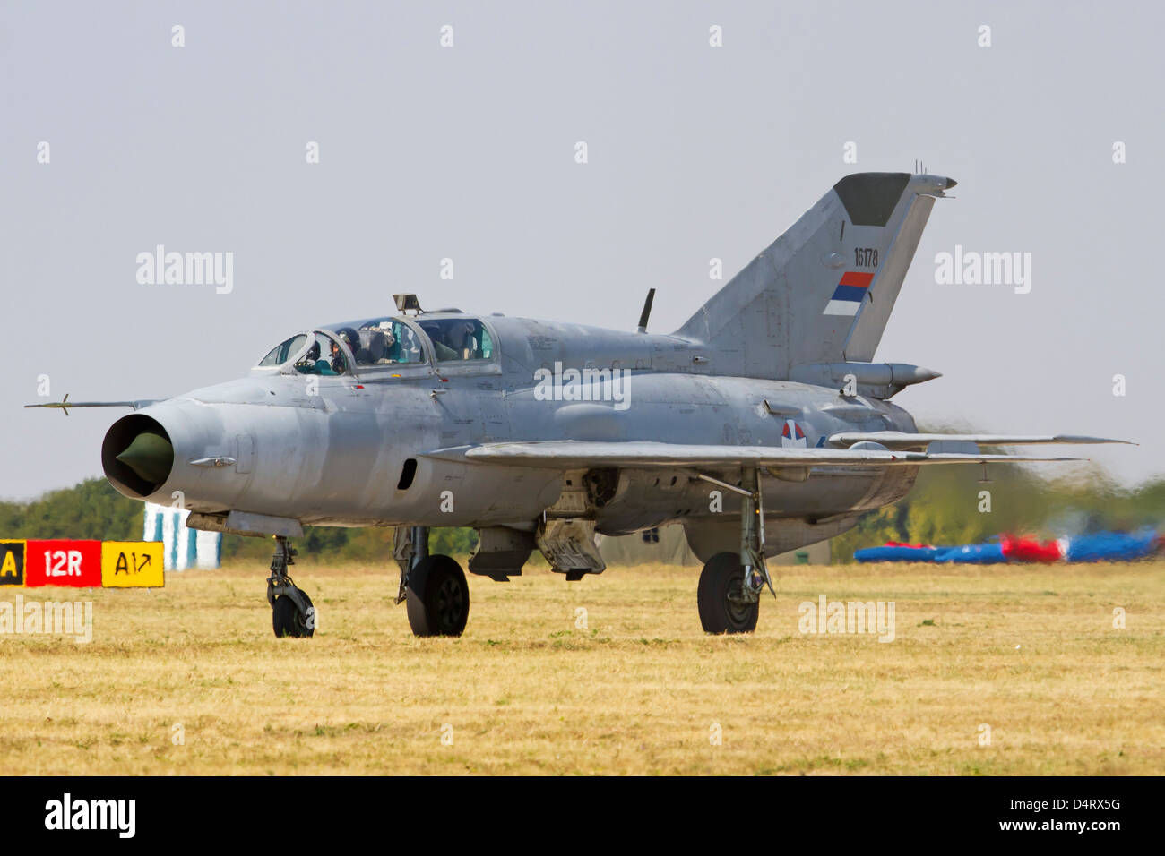 A Serbian Air Force MiG-21UM taxiing at Batajnica Air Base, Serbia. Stock Photo