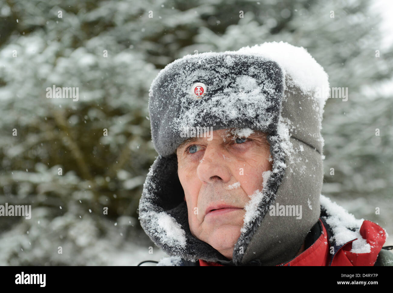 Man wearing East German border guard hat. winter winters hats freezing cold  clothing clothes keeping warm Stock Photo - Alamy