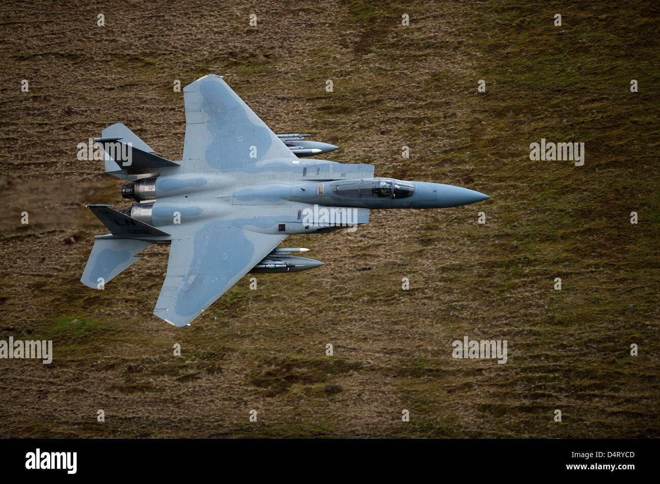 F-15E Strike Eagle low flying over North Wales, United Kingdom. Stock Photo
