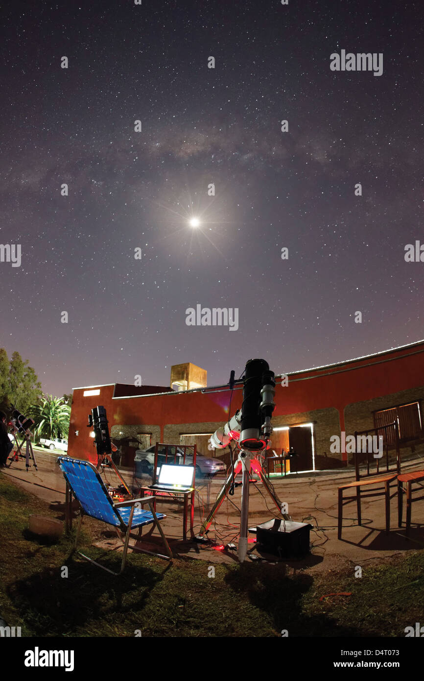 Astrophotography setup with the moon and the Milky Way in the background, Doyle, Argentina. Stock Photo
