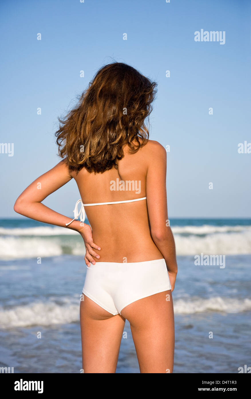 Teenage Girl Wearing White Bikini on Beach Stock Photo - Alamy