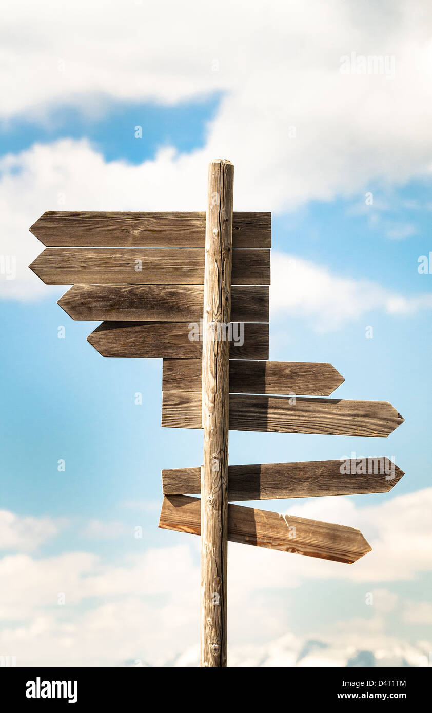Wood sign with multiple direction arrows. Stock Photo