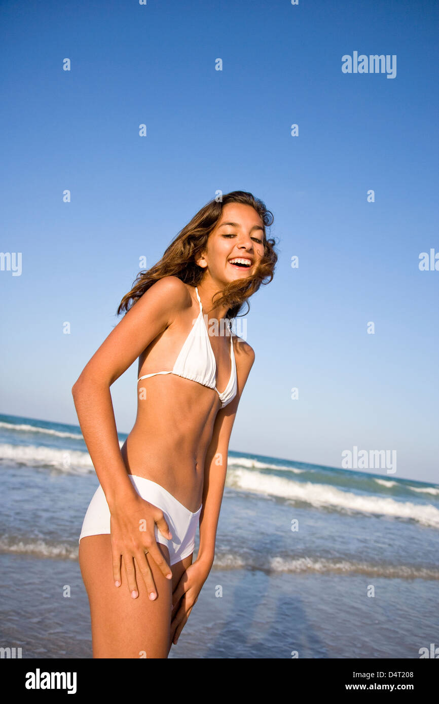 Teenage Girl Wearing White Bikini on Beach Stock Photo - Alamy