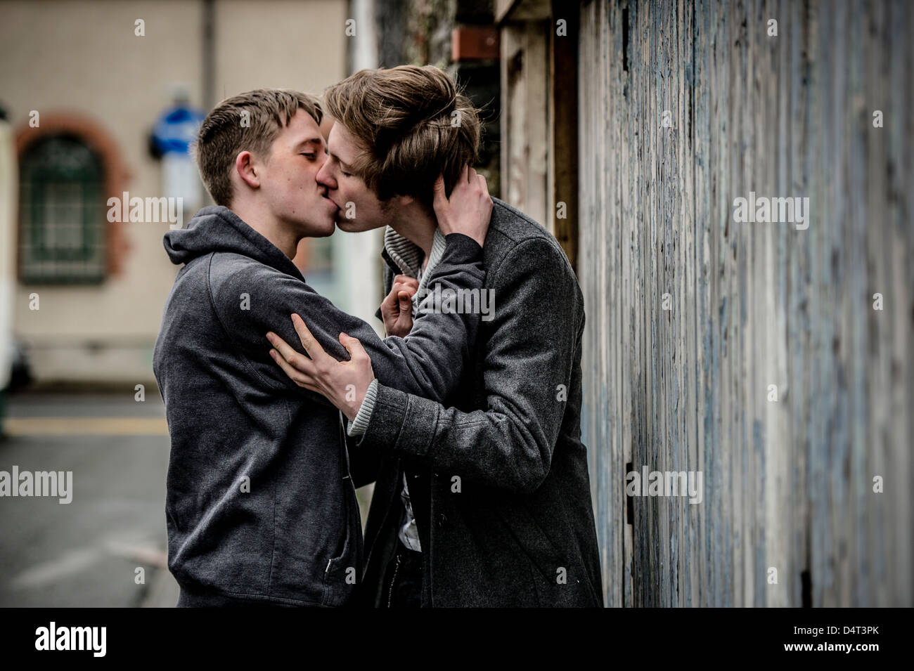 Two gay teenage boys kissing in public, UK Stock Photo - Alamy