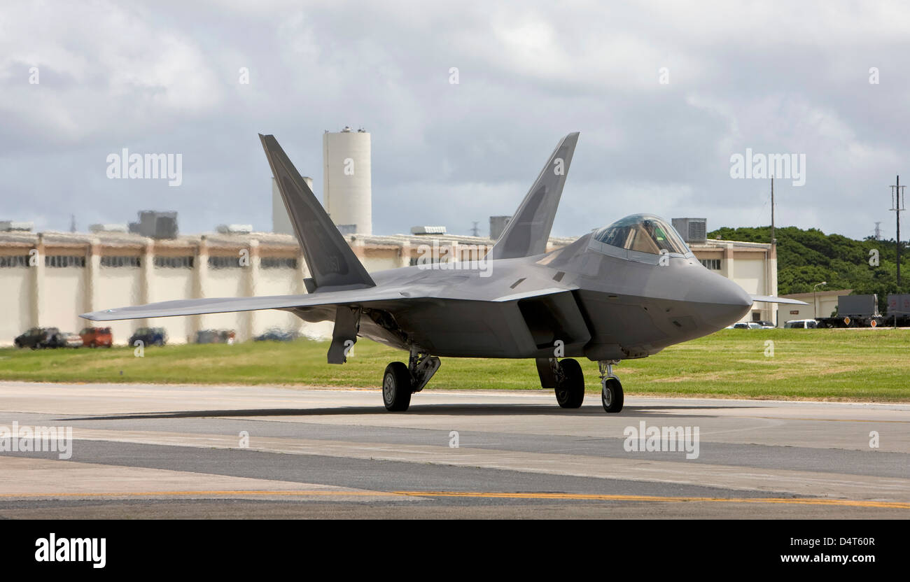 An F-22 Raptor taxi's to the end of runway at Kadena Air Base, Japan. Stock Photo