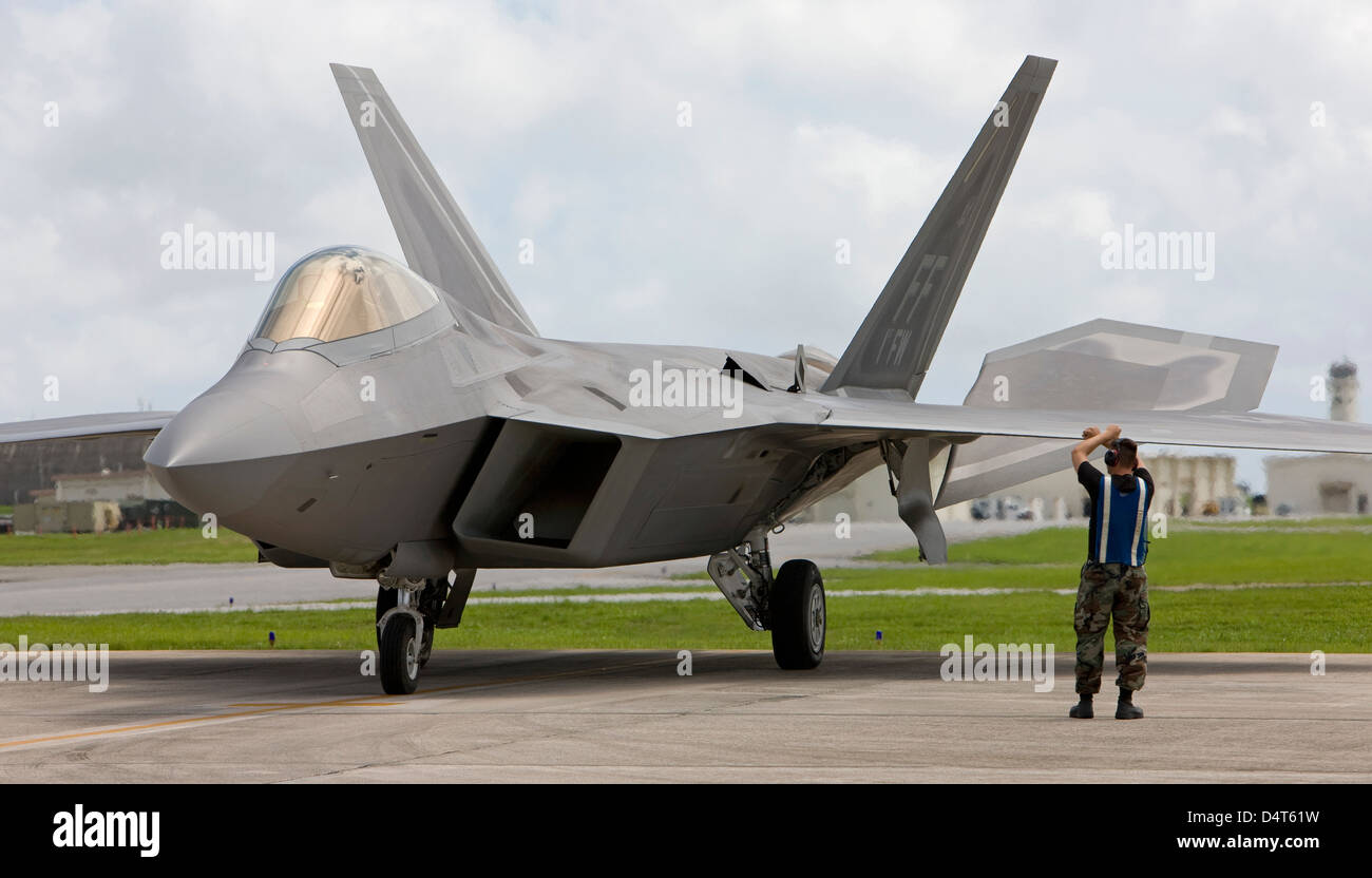 An F-22 Raptor goes through pre-flight checks at Kadena Air Base. Stock Photo