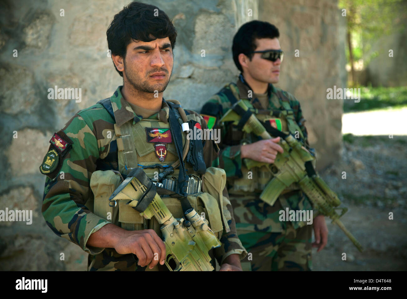 An Afghan National Army Special Forces commandos maintain security during an Afghan Local Police recruitment validation March 16, 2013 in Helmand province, Afghanistan. Stock Photo