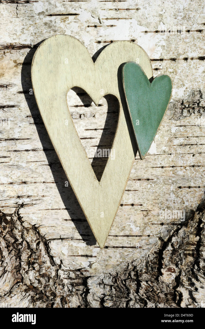 a pair of wooden hearts on white background Stock Photo
