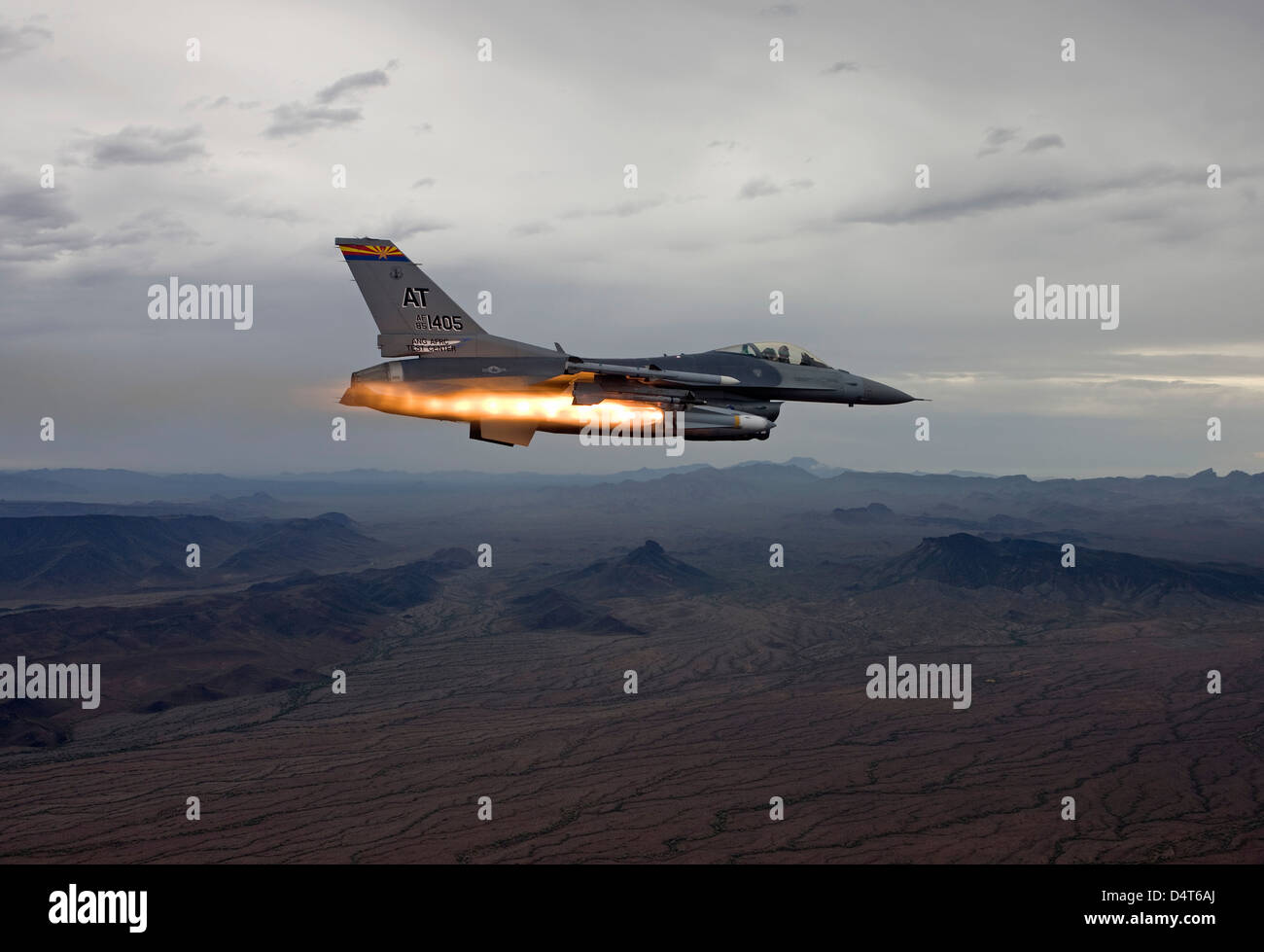 An F-16 Fighting Falcon fires an AGM-65 Maverick missile. Stock Photo