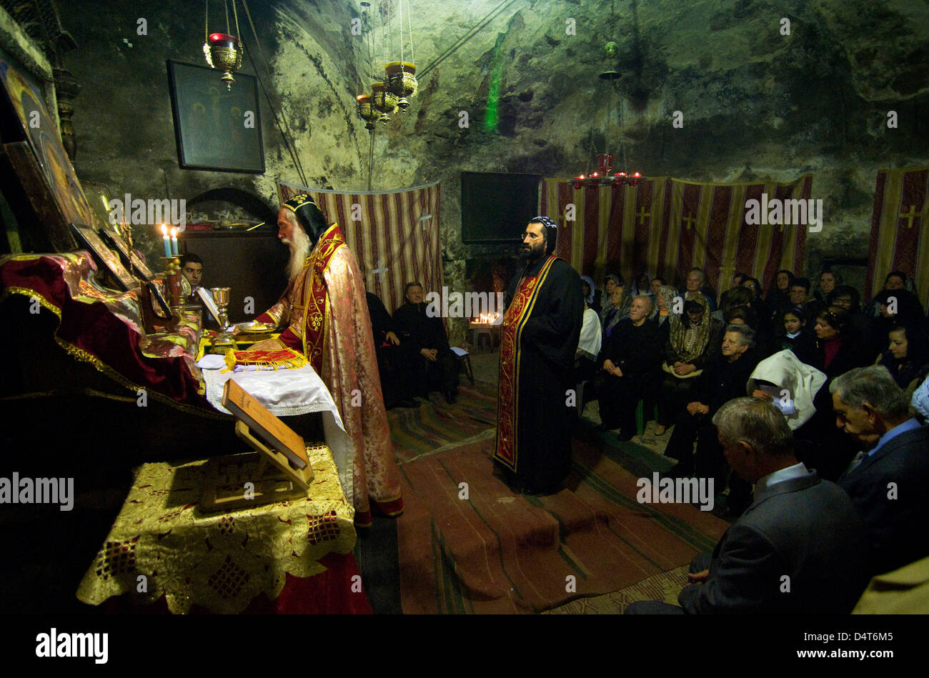 Syrian Orthodox hold prayers in their small chapel inside the church of the holy Sepulchre in Jerusalem. Stock Photo