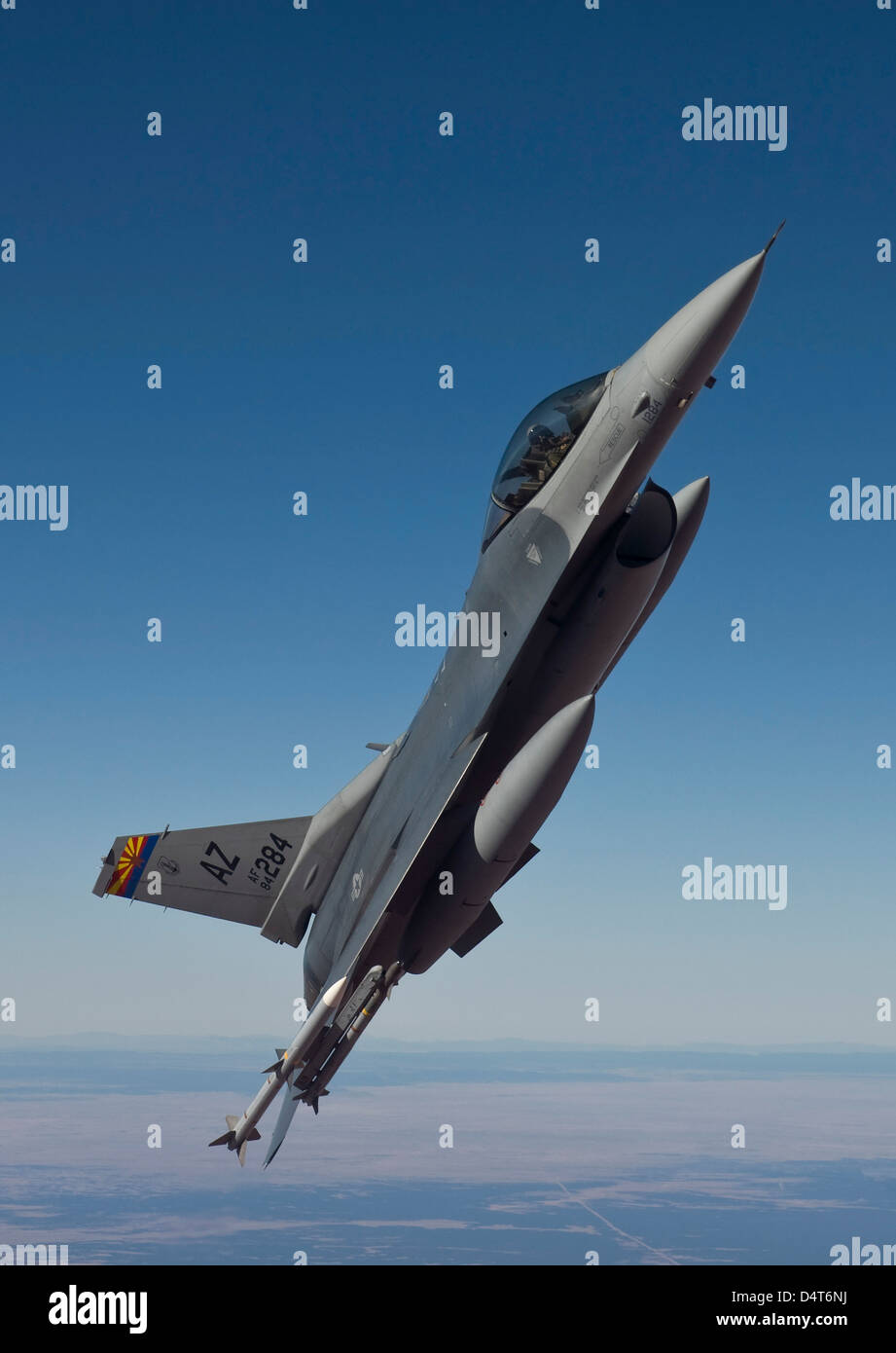 An F-16 Fighting Falcon maneuvers over Arizona. Stock Photo
