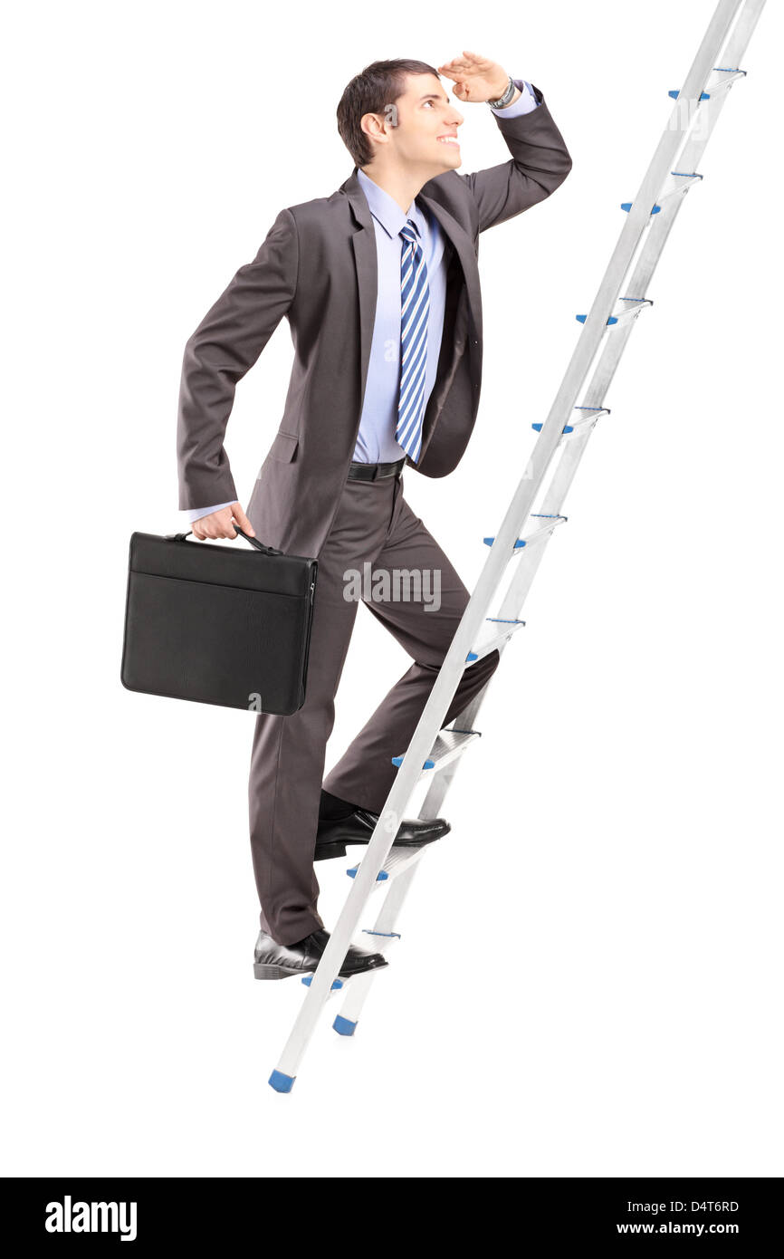 Full length portrait of a businessman with briefcase climbing a ladder isolated on white background Stock Photo
