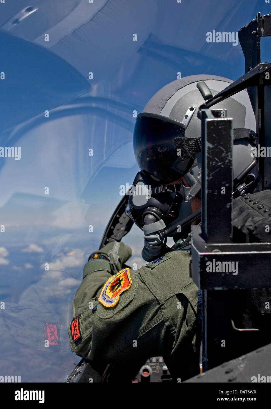 A F-15 pilot from the 173rd Fighter Wing looks over at his wingman during a training mission over Central Oregon. Stock Photo