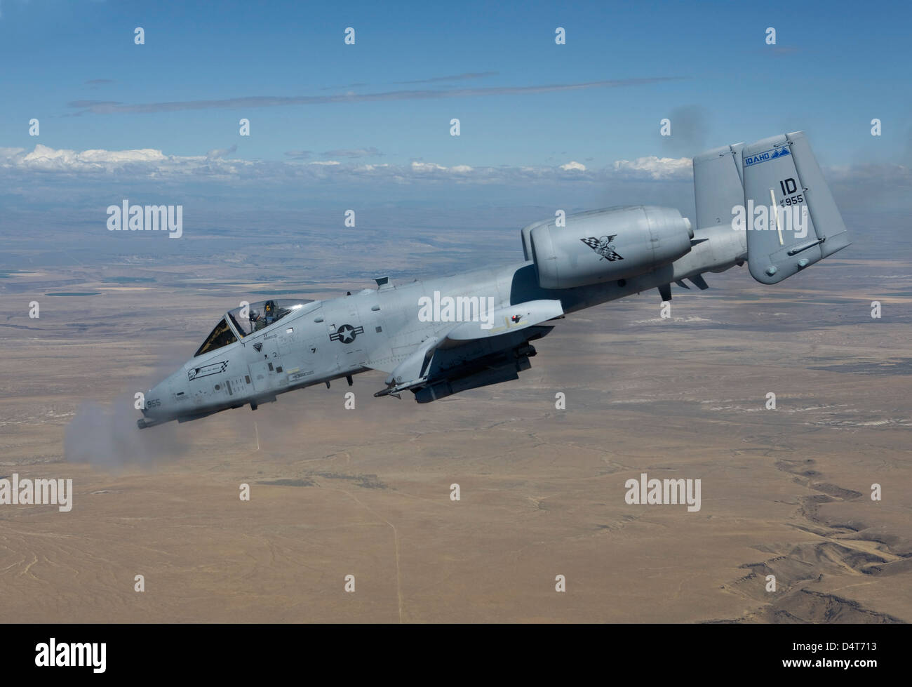 An A-10C Thunderbolt from the 190th Fighter Squadron fires its 30mm cannon during a training mission out of Boise, Idaho. Stock Photo