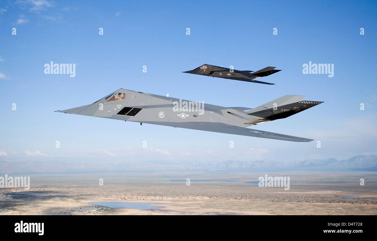 Two F-117 Nighthawk stealth fighters fly on a training sortie out of of Holloman Air Force Base, New Mexico. Stock Photo