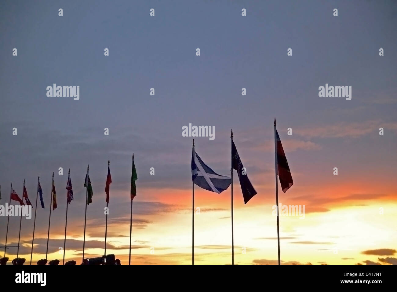 flags at sunset by castle during tattoo Stock Photo