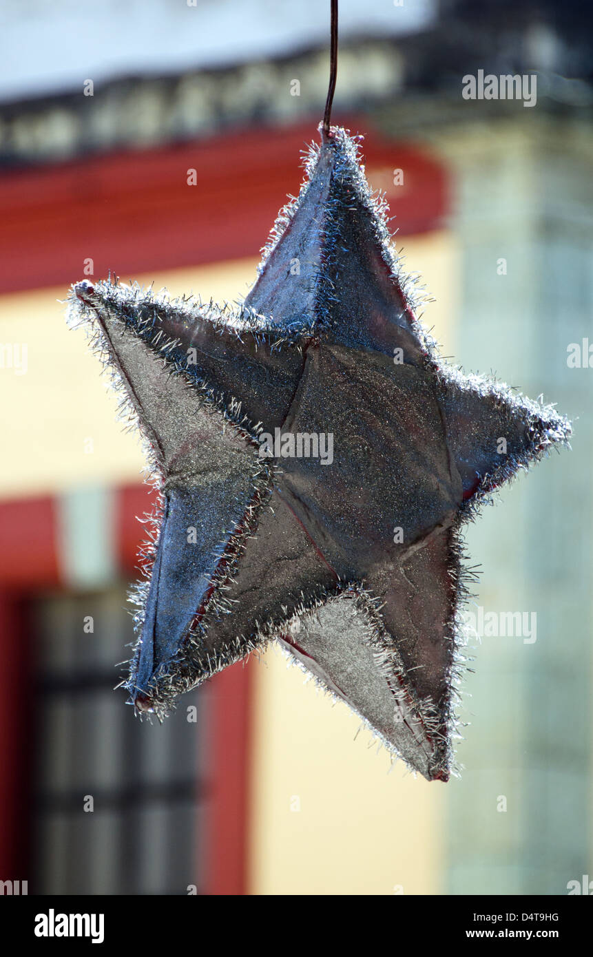 A silver star lantern decorates Oaxaca's Zocalo for Christmas. (Mexico) Stock Photo