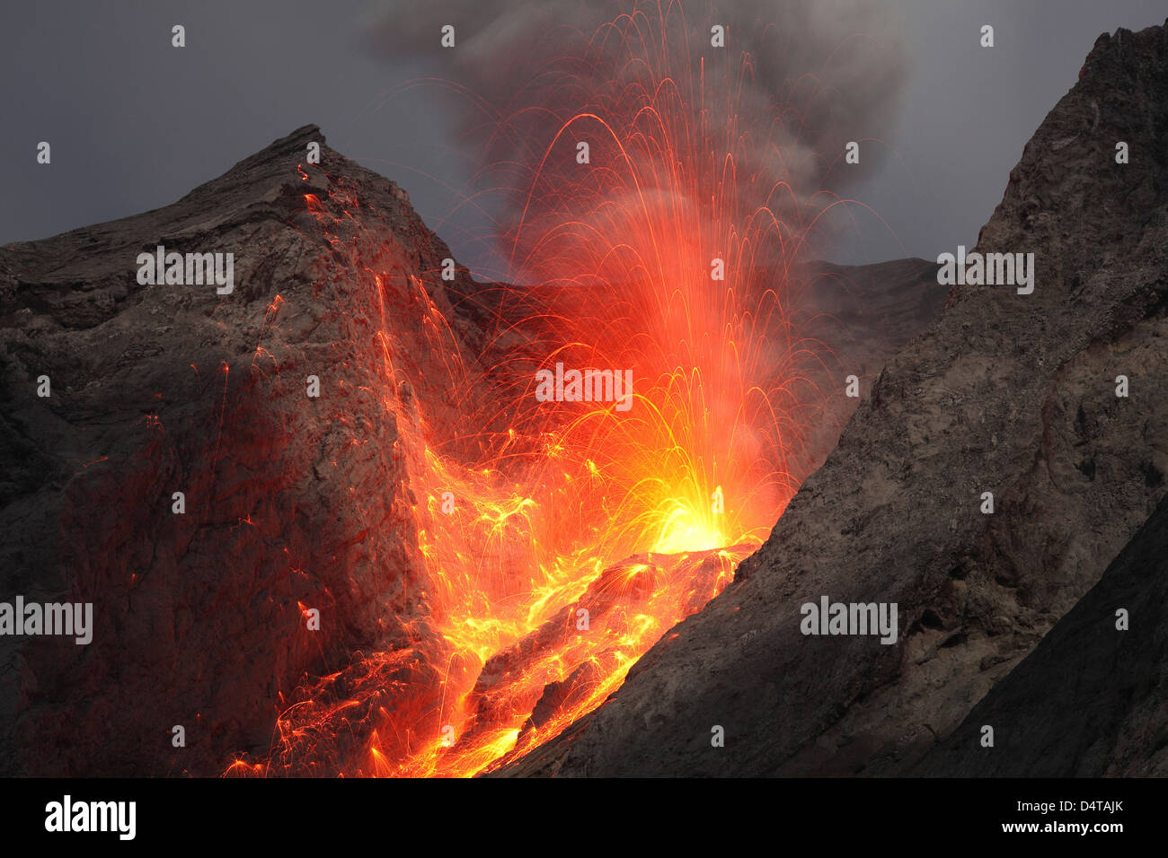 Strombolian type eruption of Batu Tara volcano, Indonesia. Stock Photo