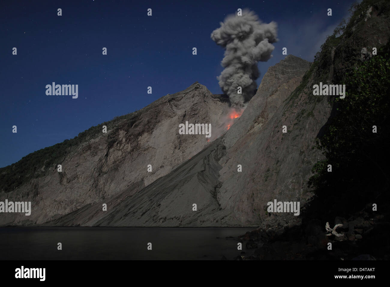 Strombolian type eruption of Batu Tara volcano, Indonesia. Stock Photo