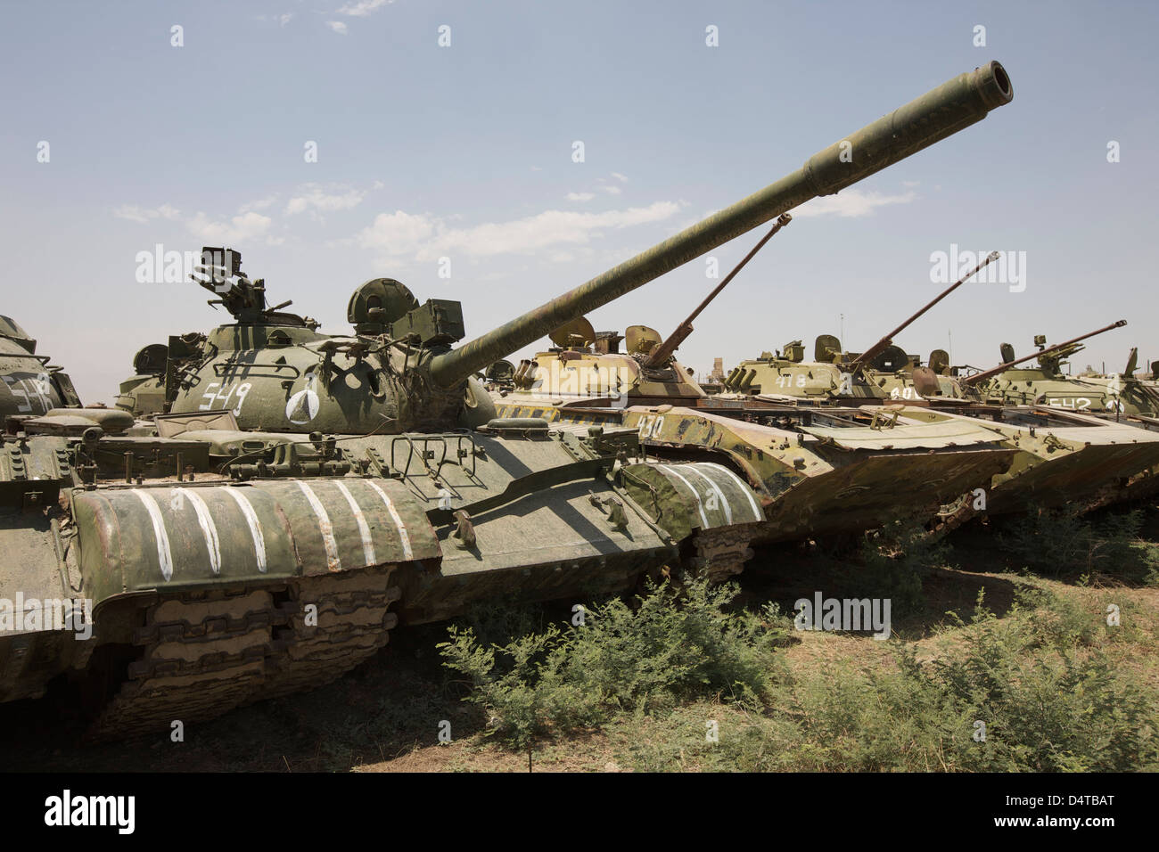 Russian T-54 and T-55 main battle tanks rest in an armor junkyard in Kunduz, Afghanistan. Stock Photo