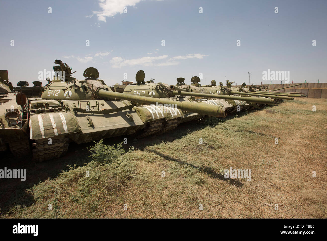 Russian T-54 and T-55 main battle tanks rest in an armor junkyard in Kunduz, Afghanistan. Stock Photo