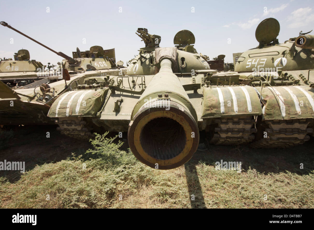 Russian T-54 and T-55 main battle tanks rest in an armor junkyard in Kunduz, Afghanistan. Stock Photo