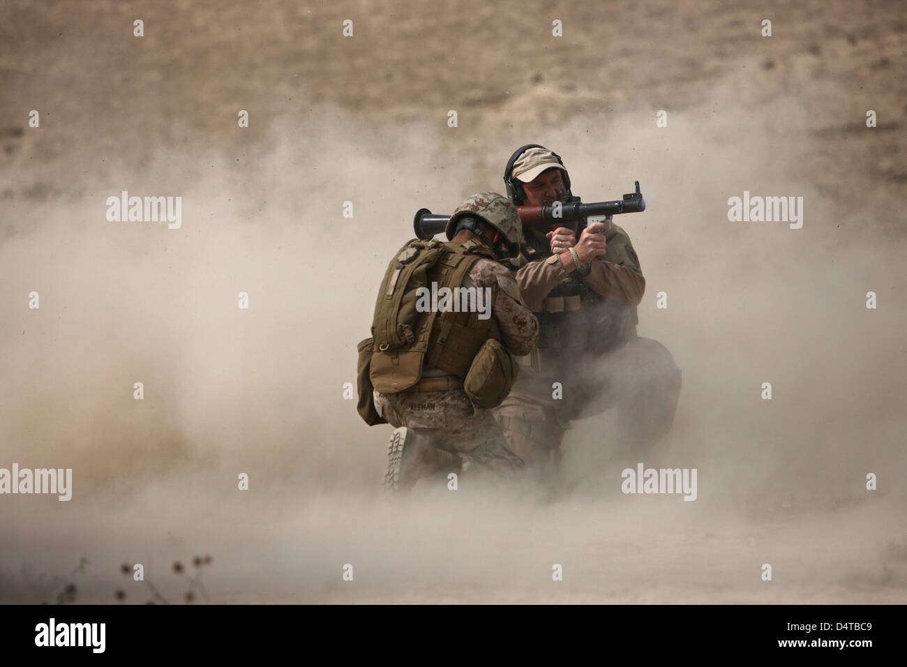 U.S. Marine fires an HE fragmentation round from the RPG-7 rocket-propelled grenade launcher in a wadi near Kunduz, Afghanistan. Stock Photo